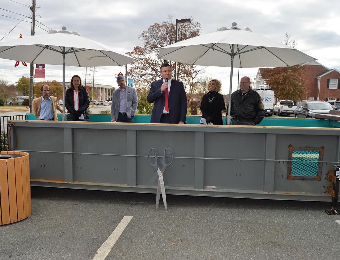 Congratulations to @grahamrecnc & partners on the official opening of the Mobile Parklet! Thank you for bringing this unique and innovative idea to Alamance County! / A parklet is a small seating area or green space created as a public amenity on or alongside a sidewalk, especially in a former roadside parking space.